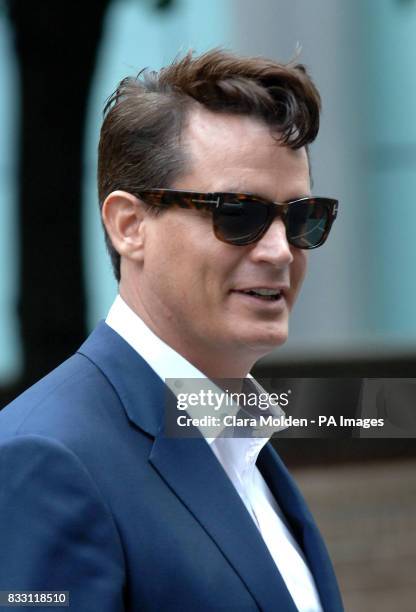 American oil and banking heir Matthew Mellon leaves Southwark Crown Court in London after being cleared today of teaming up with a crooked private...