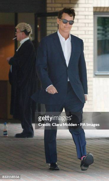 American oil and banking heir Matthew Mellon leaves Southwark Crown Court in London after being cleared today of teaming up with a crooked private...
