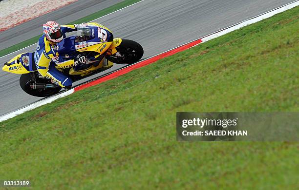 Rider Colin Edwards of Tech 3 Yamaha leans to his right on a bend of Sepang circuit during the free practice session on October 17, 2008 in Sepang...
