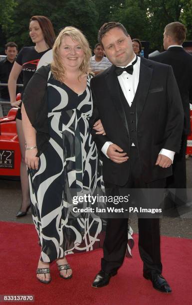 Paul Potts and his wife Julie Ann arrive at the A1 Grand Prix Ball, at the Royal Albert Hall in London.