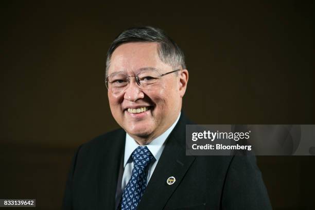 Carlos Dominguez, the Philippines' secretary of finance, poses for a photograph after a Bloomberg Television interview in Singapore, on Tuesday, Aug....