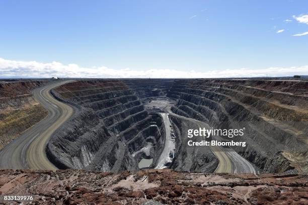 Dump trucks travels along an access ramp to the Invincible mine at the St Ives Gold Mine operated by Gold Fields Ltd. In Kambalda, Australia, on...