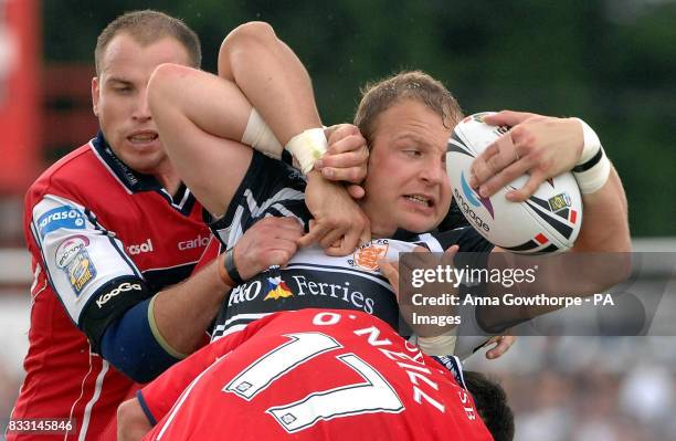 Hull FC's Garreth Carvell looks to offload the ball under pressure from Hull KR's Jim Gannon and Mark O'Neill during the engage Super League match at...