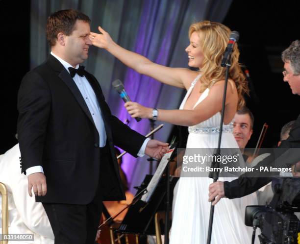 Welsh mezzo-soprano Katherine Jenkins congratulates Paul Potts after he sang at the Katherine in the Park event in the grounds of Margam Park in...