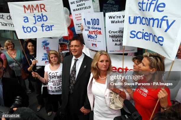 Dr Andrew Wakefield stands with his wife Carmel as they arrive at a General Medical Council hearing in central London where Dr Wakefield will hear...