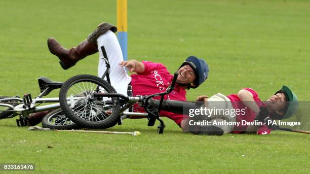 Clayton Fredericks laughs after falling off his bicycle during the Jockeys Vs Eventers Charity match at Tidworth Polo Club in Wiltshire, PRESS...