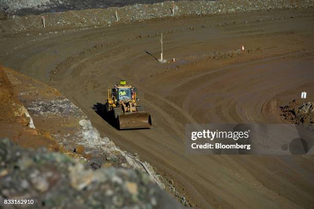 An bulldozer operates in the Neptune open pit mine at the St Ives Gold Mine operated by Gold Fields Ltd. In Kambalda, Australia, on Wednesday, Aug....