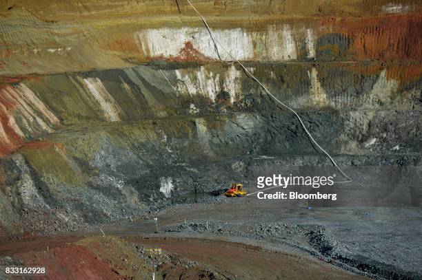 Equipment operates in the Neptune open pit mine at the St Ives Gold Mine operated by Gold Fields Ltd. In Kambalda, Australia, on Wednesday, Aug. 9,...