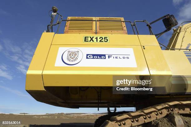 The Gold Fields Ltd. Logo is displayed on an excavator at the company's St Ives Gold Mine in Kambalda, Australia, on Wednesday, Aug. 9, 2017. Global...