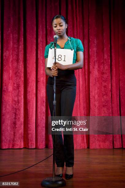 contestant auditioning, standing at microphone - audition ストックフォトと画像