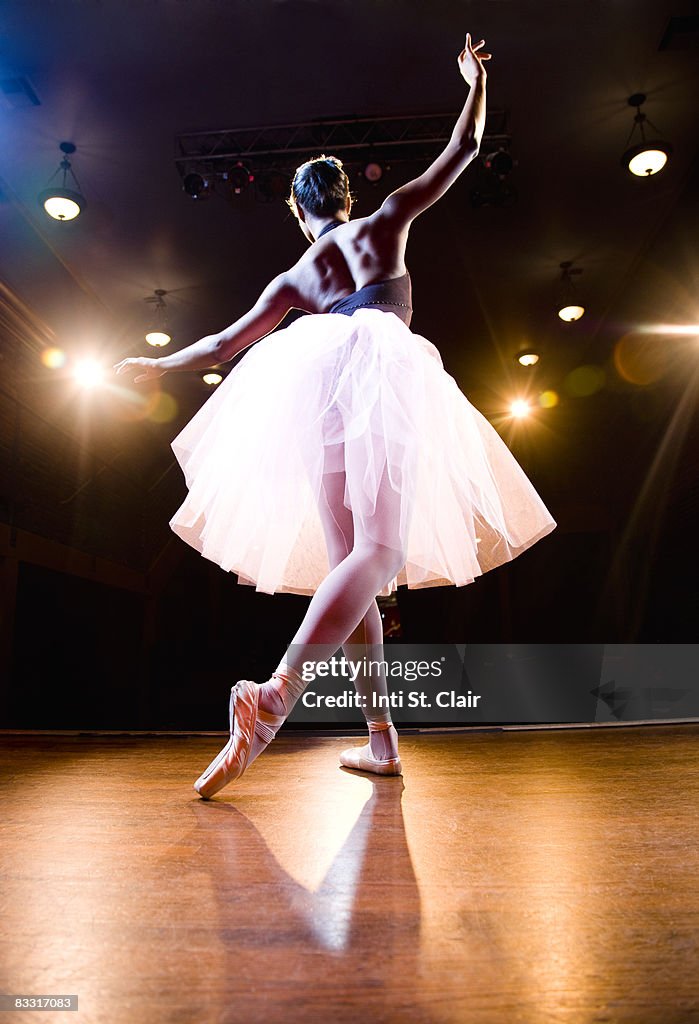 Female ballerina on stage dancing