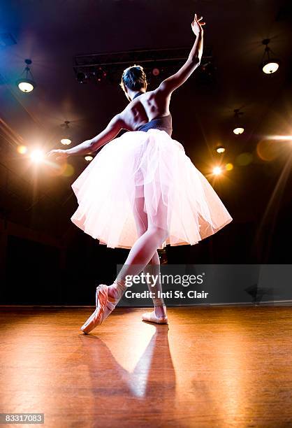 female ballerina on stage dancing - ballet stage stock pictures, royalty-free photos & images