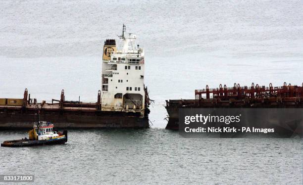 The MSC Napoli is spilt in two after salvage experts used controlled explosions on the remaining two longitudinal ribs which were holding the two...