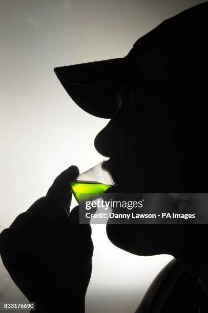 Member of the public takes his prescription of methadone at a Houlihan pharmacy in Glasgow.