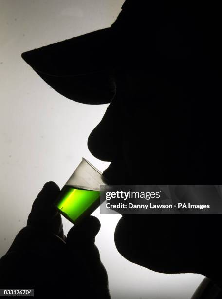 Member of the public takes his prescription of methadone at a Houlihan pharmacy in Glasgow.