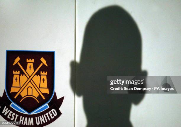 Shadow showing the head of West Ham United chairman Eggert Magnusson during a press conference announcing new signing Freddie Ljungberg at Upton...