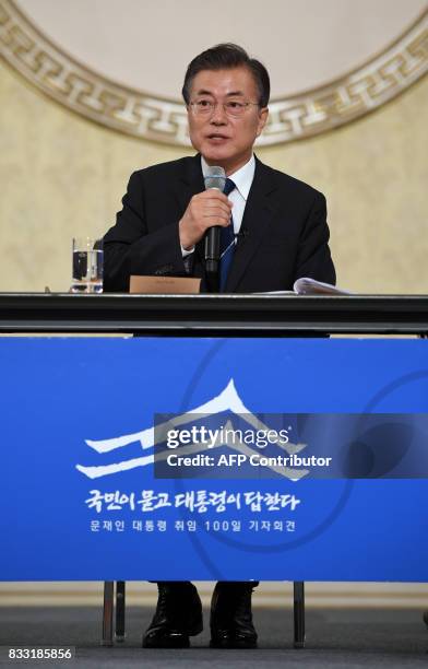 South Korea's President Moon Jae-In speaks during a press conference marking his first 100 days in office at the presidential house in Seoul on...