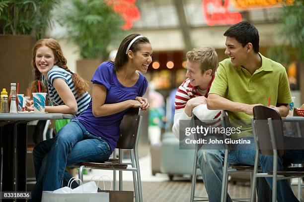 boys and girls talking at the food court. - food court stock pictures, royalty-free photos & images