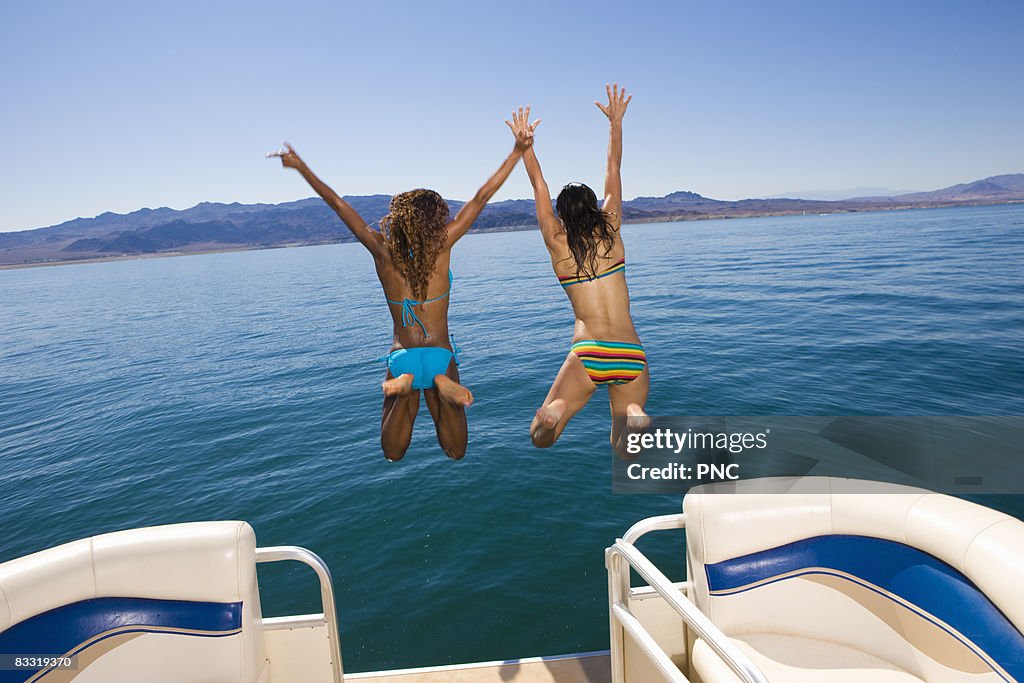 Girls jump off boat