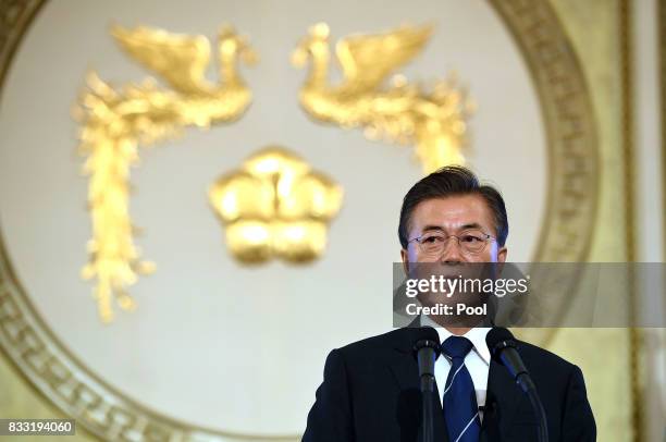 South Korean President Moon Jae-in speaks during a press conference marking his first 100 days in office at the presidential blue house on August 17,...