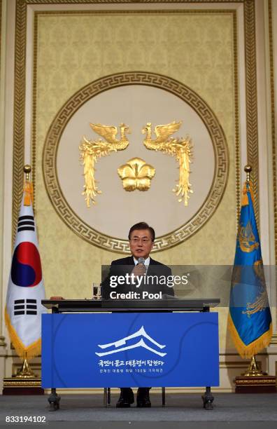 South Korean President Moon Jae-in speaks during a press conference marking his first 100 days in office at the presidential blue house on August 17,...