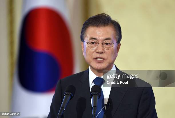 South Korean President Moon Jae-in speaks during a press conference marking his first 100 days in office at the presidential blue house on August 17,...