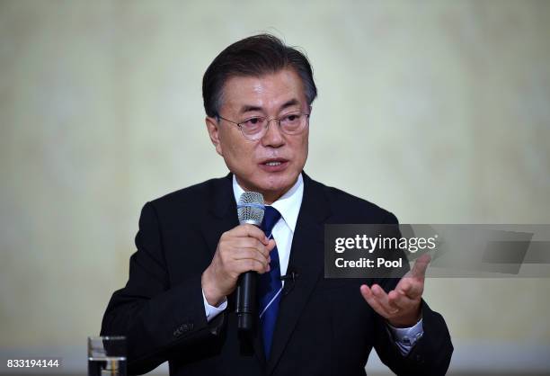 South Korean President Moon Jae-in speaks during a press conference marking his first 100 days in office at the presidential blue house on August 17,...