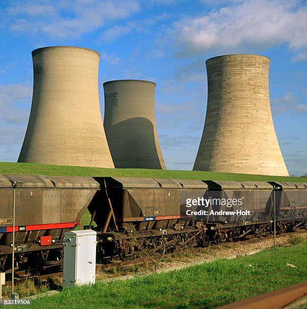 coal train railway wagons and cooling towers - coal fired power station stock pictures, royalty-free photos & images