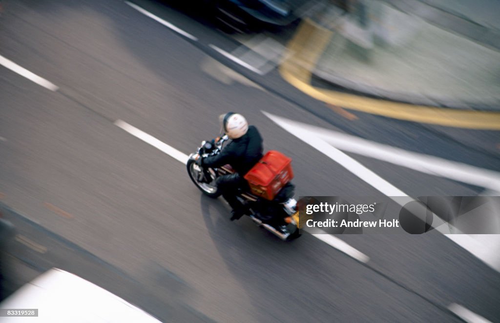 Motorcycle courier or Pizza delivery speeding