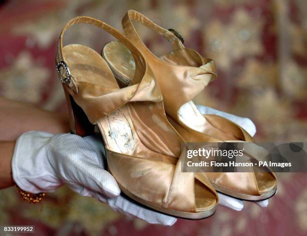 Satin bridal shoes, made by Edward Rayne, which accompanied the Norman Hartnell wedding dress and 13 foot train worn by the then Princess Elizabeth ,...