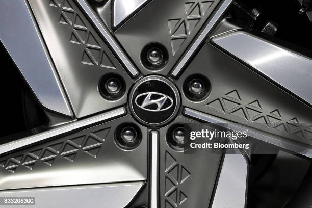 The Hyundai Motor Co. Logo is displayed on the wheel cap of its next generation fuel-cell electric sport utility vehicle during an unveiling event in...