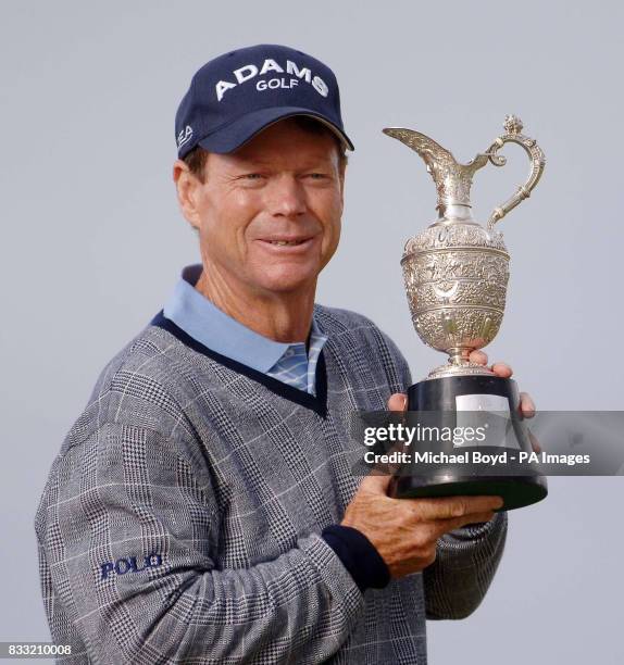 S Tom Watson holds up the trophy after winning the Senior British Open Championship, Muirfield, East Lothian, Scotland.