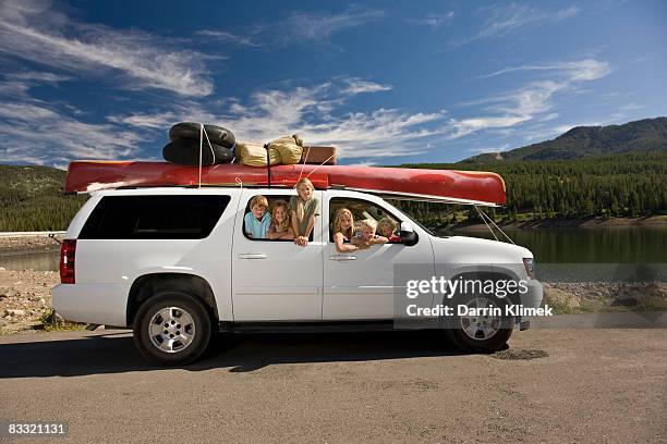 kids hanging out of back of suv - suv stock-fotos und bilder