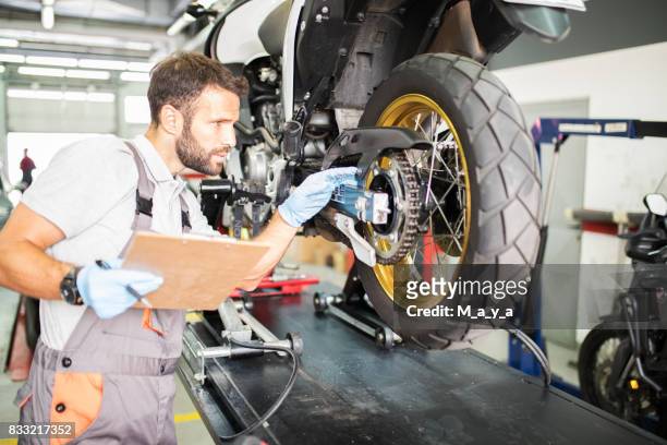 cheking list of prescribed maintenance tasks - motorcycle workshop stock pictures, royalty-free photos & images