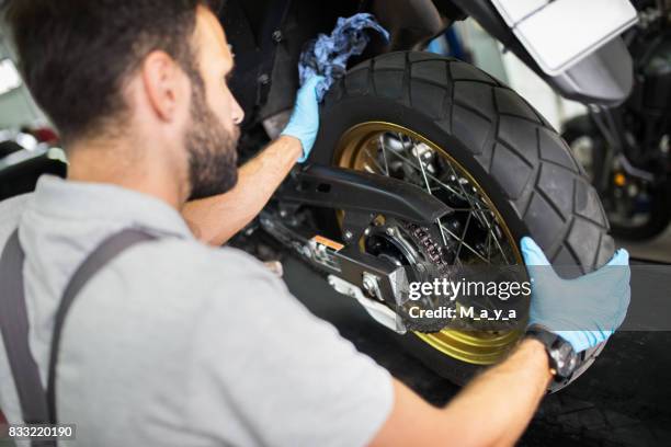 tire replacement on motorcycle - bike tyre stock pictures, royalty-free photos & images