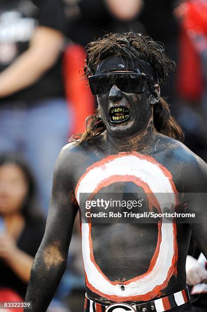 Fan of the Georgia Bulldogs dressed in all black cheers during a game against the Alabama Crimson Tide at Sanford Stadium on September 27, 2008 in...