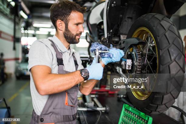 at motorcycle servicess - motorcycle workshop stock pictures, royalty-free photos & images