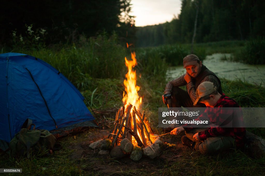 Father and son camping together