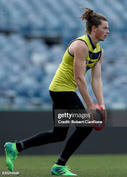 Wylie Buzza of the Cats lines up a kick during a Geelong Cats AFL training session at Simonds Stadium on August 17, 2017 in Geelong, Australia.