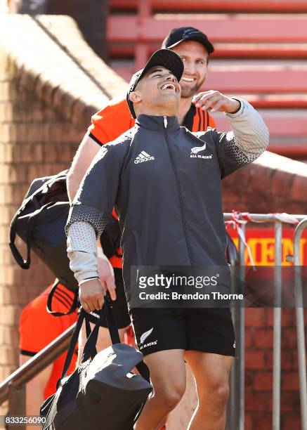 Aaron Smith of the All Blacks shares a joke with team mate Kieran Read during a New Zealand All Blacks training session at North Sydney Oval on...