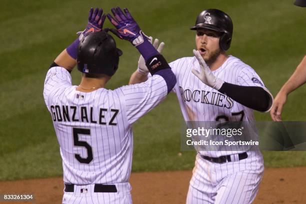 Colorado Rockies shortstop Trevor Story celebrates with outfielder Carlos Gonzalez after hitting a home run during the Colorado Rockies game vs. The...