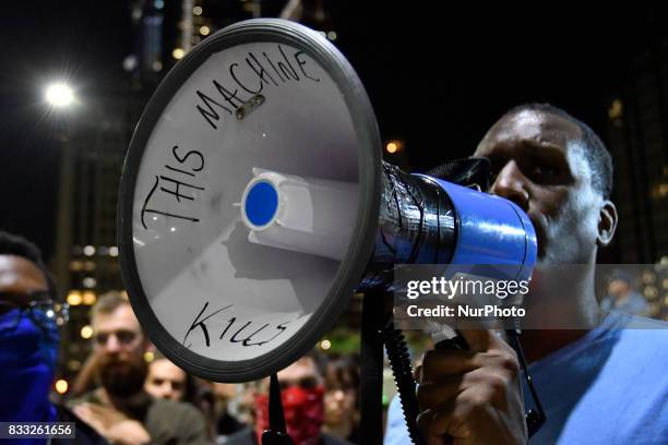 Protestors face a police force at an attempt to take down the statue of former Mayor and police commissioner Frank Rizzo, across from City Hall, in...