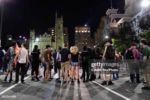 Protestors face a police force at an attempt to take down the statue of former Mayor and police commissioner Frank Rizzo, across from City Hall, in...