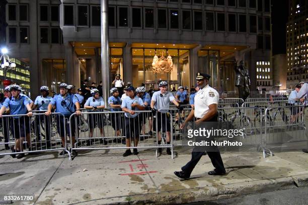 Protestors face a police force at an attempt to take down the statue of former Mayor and police commissioner Frank Rizzo, across from City Hall, in...