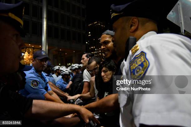 Protestors face a police force at an attempt to take down the statue of former Mayor and police commissioner Frank Rizzo, across from City Hall, in...