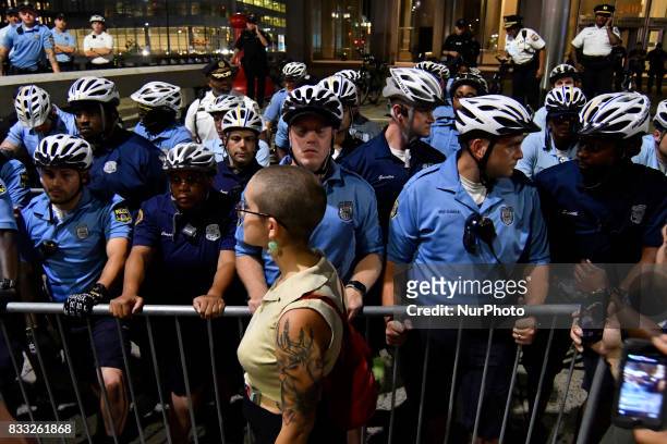 Protestors face a police force at an attempt to take down the statue of former Mayor and police commissioner Frank Rizzo, across from City Hall, in...
