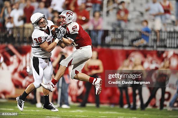 Ball State Alex Knipp in action, breaking up pass vs Western Kentucky Jake Gaebler during 4th quarter. Incompletion. Bowling Green, KY CREDIT: David...