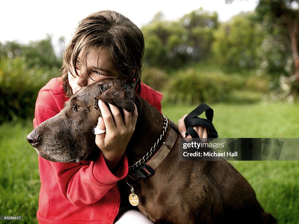 Girl with dog in country field