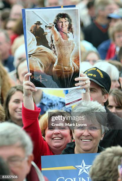 Woman hold up a sign during a rally by Republican vice presidential candidate Alaska Governor Sarah Palin October 17, 2008 in West Chester, Ohio. It...