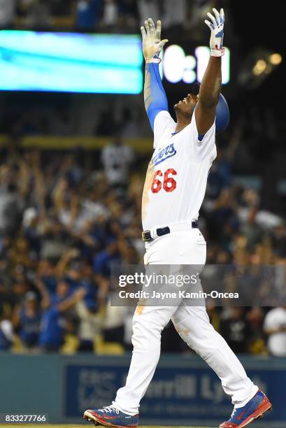 Yasiel Puig of the Los Angeles Dodgers celebrates a walk off three run home run to defeat the Chicago White Sox in the ninth inning of the game at...